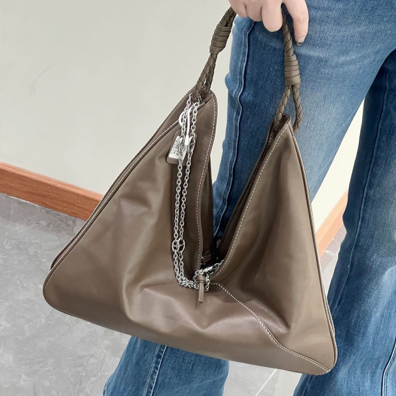 Vegetable - tanned sheepskin under - arm bag